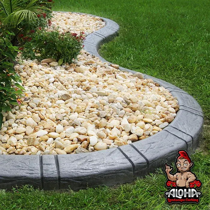 Slate Tile stamped concrete edging along a lawn